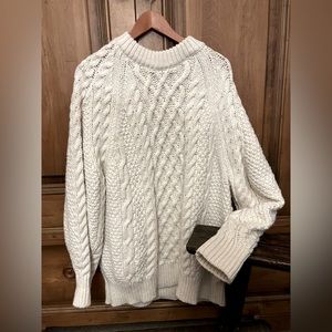Very soft and warm over sized cable knit sweater.
